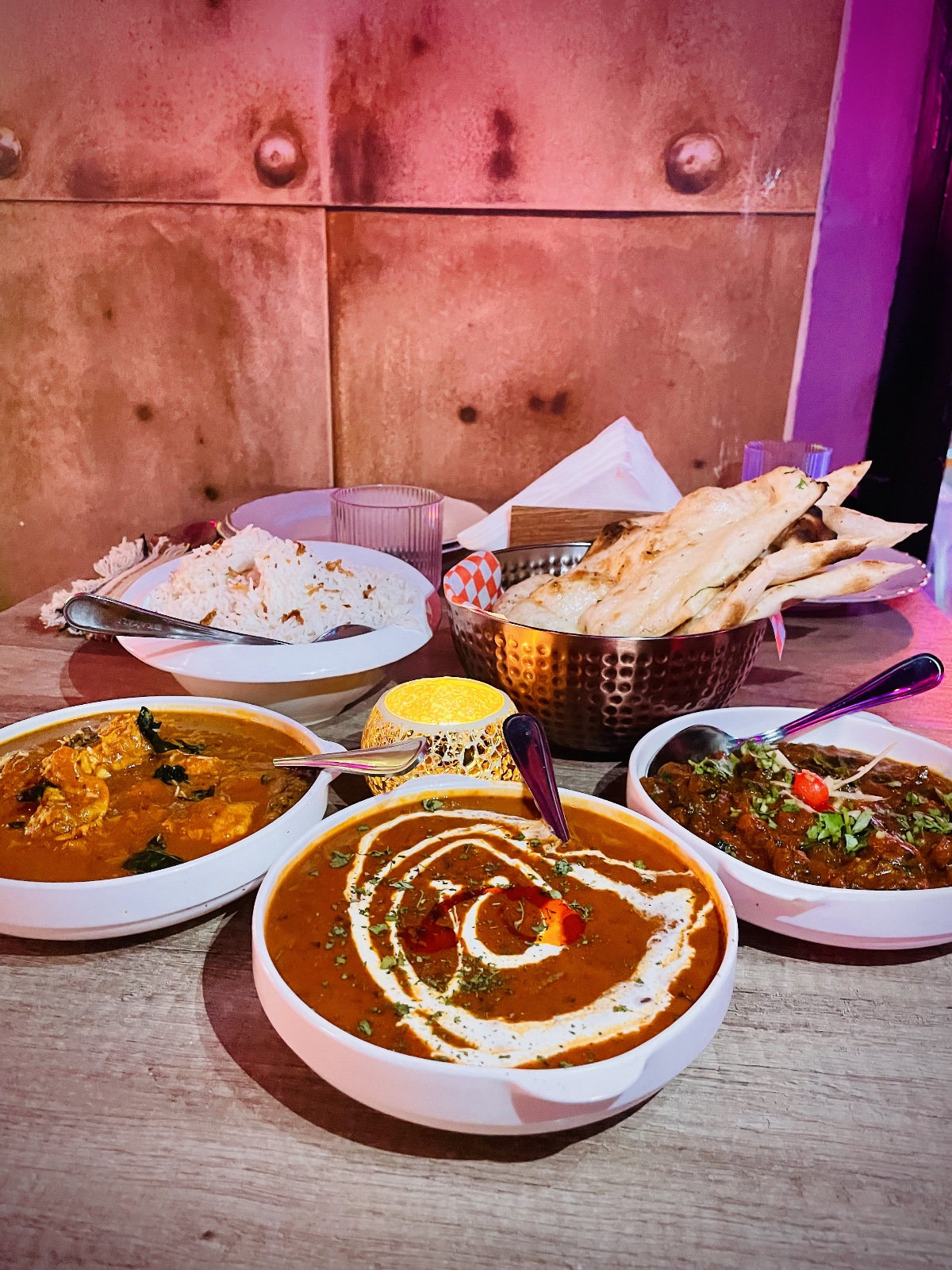 Table with various Indian dishes