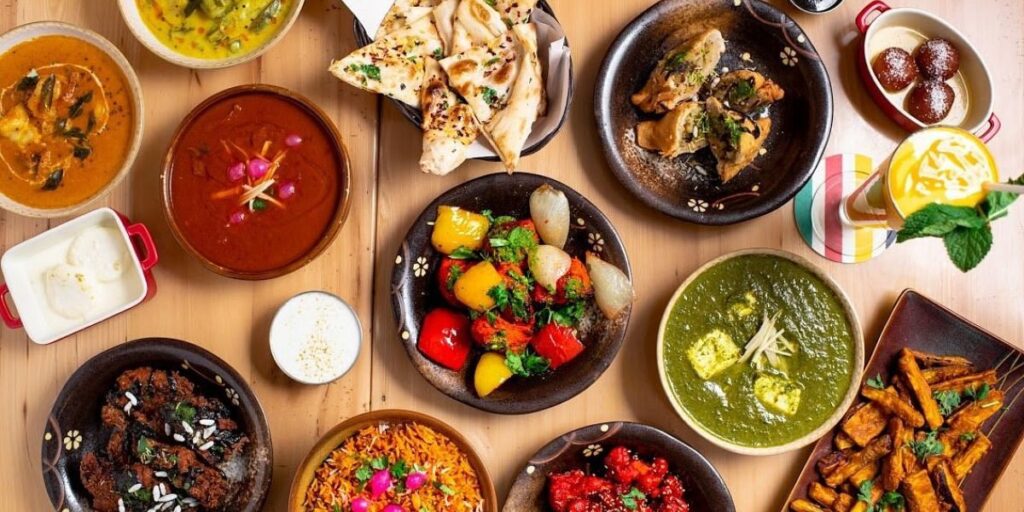 A table with various types of food displayed on it.