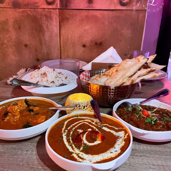 An array of delicious Indian dishes at Leela Indian Food Bar, ideal for casual lunches or formal dinners.